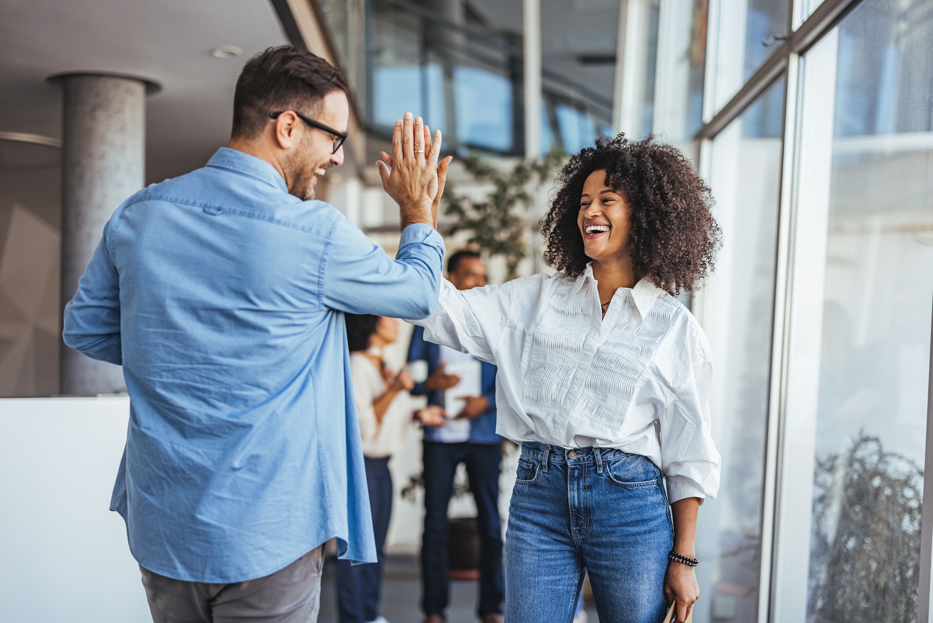 Joyful Business Colleagues Celebrating Success With High Five